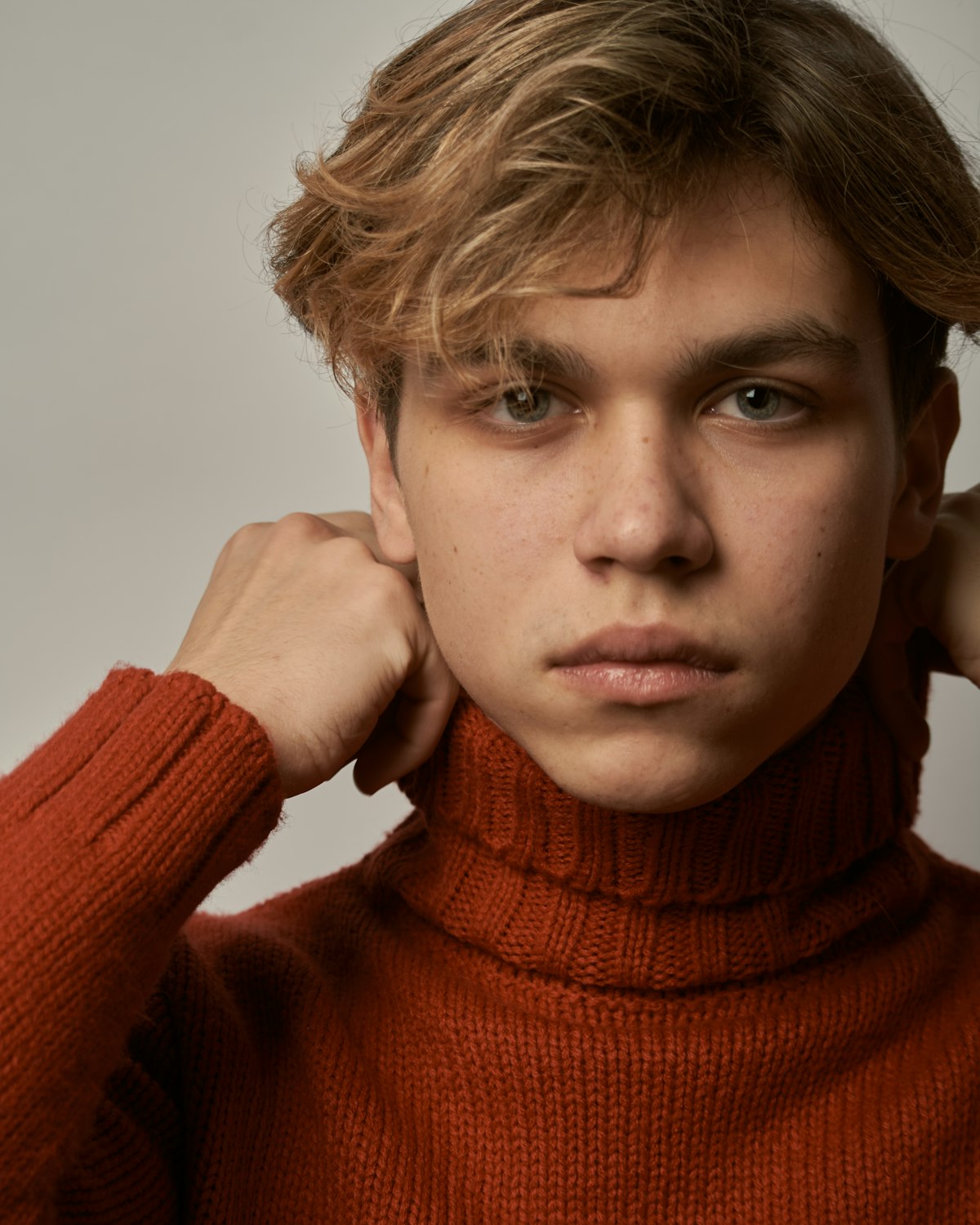 Refined merino crew knit styled in a neutral editorial portrait