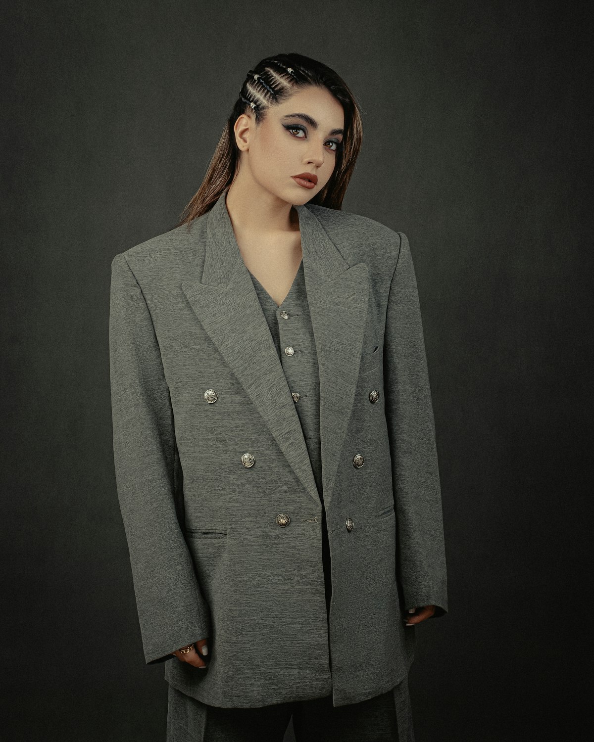 Double-breasted tailored jacket in a sharp editorial portrait